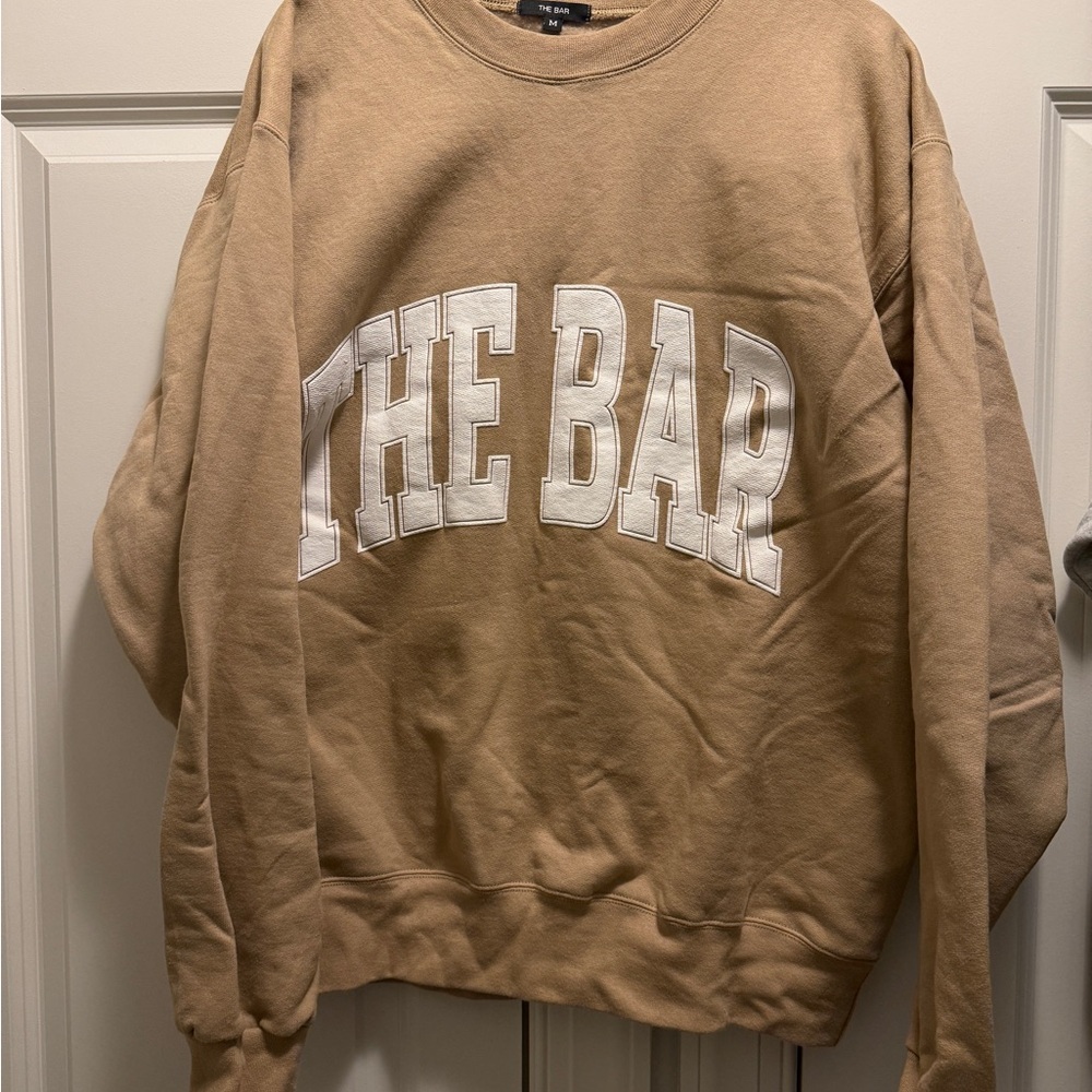 Tan Sweatshirt with White Lettering